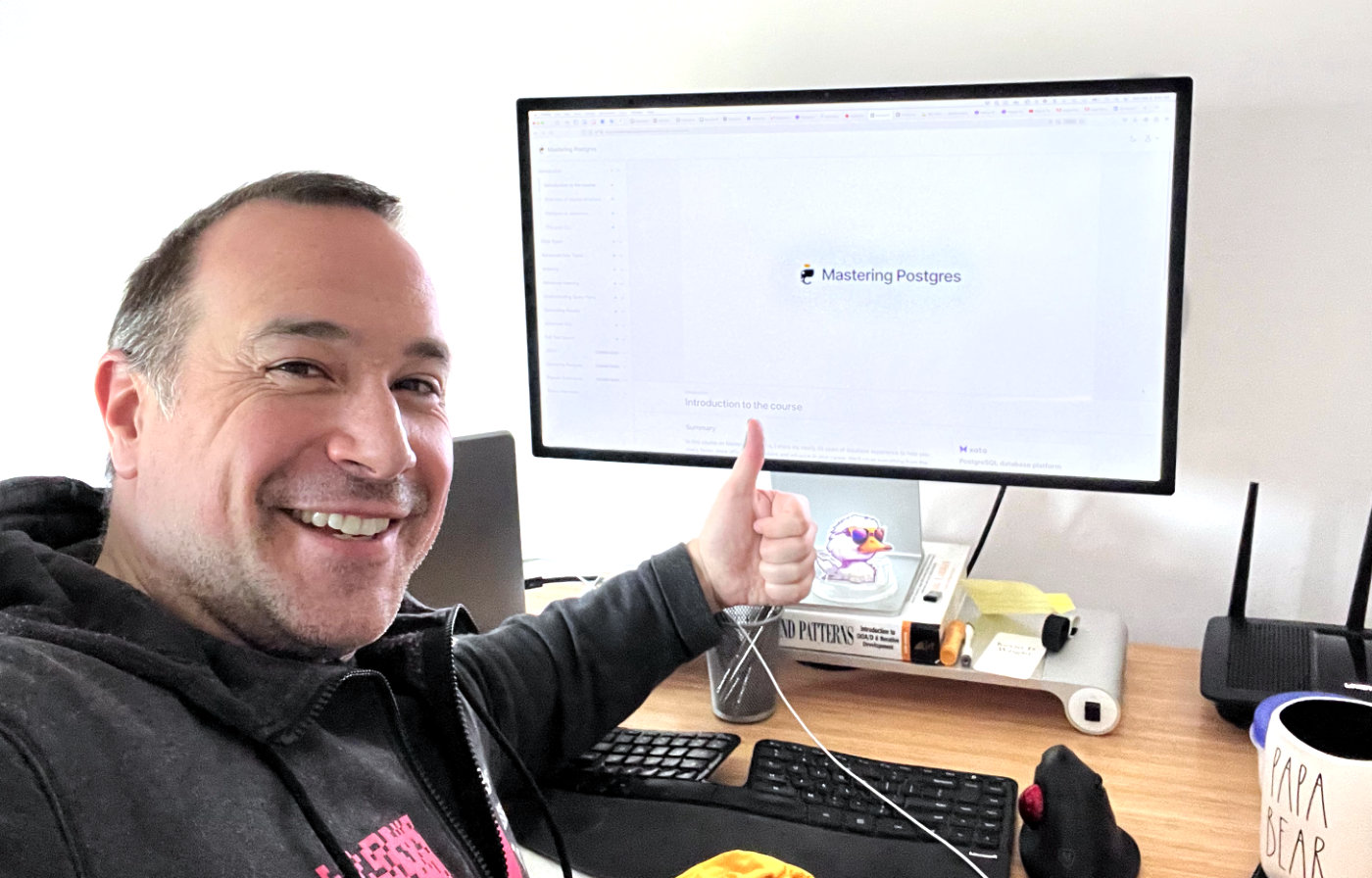 Ben Nadel giving a thumbs-up to the Mastering Postgres video course by Aaron Francis.