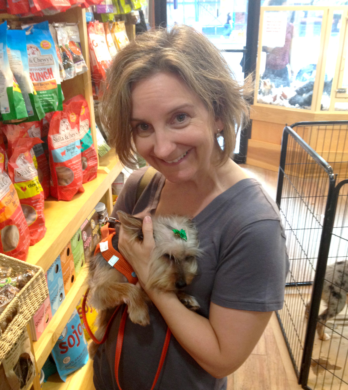 Mary Kate holding Lucy in petstore.
